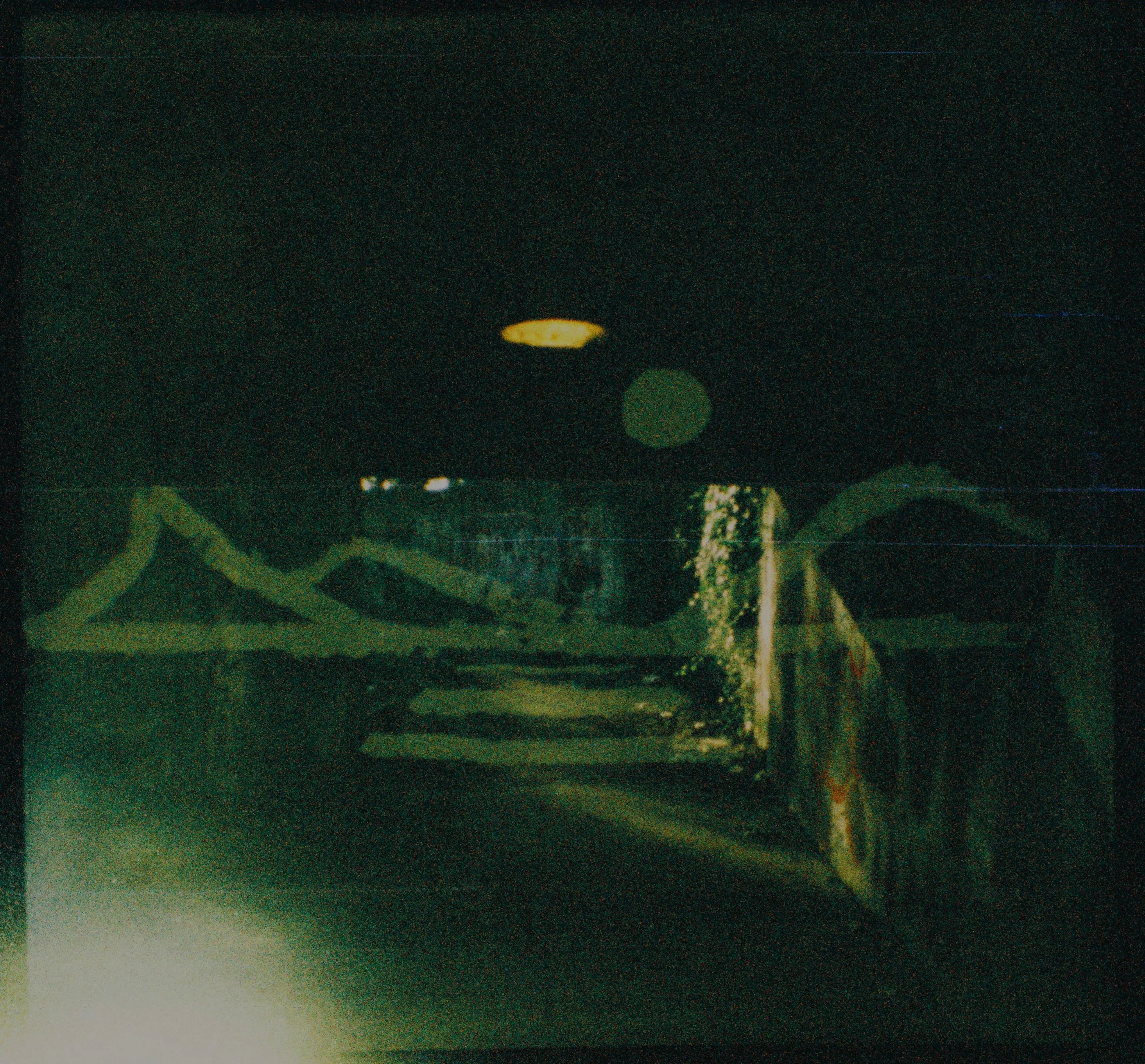 A double exposure of a pedestrian tunnel and a graffiti landscape